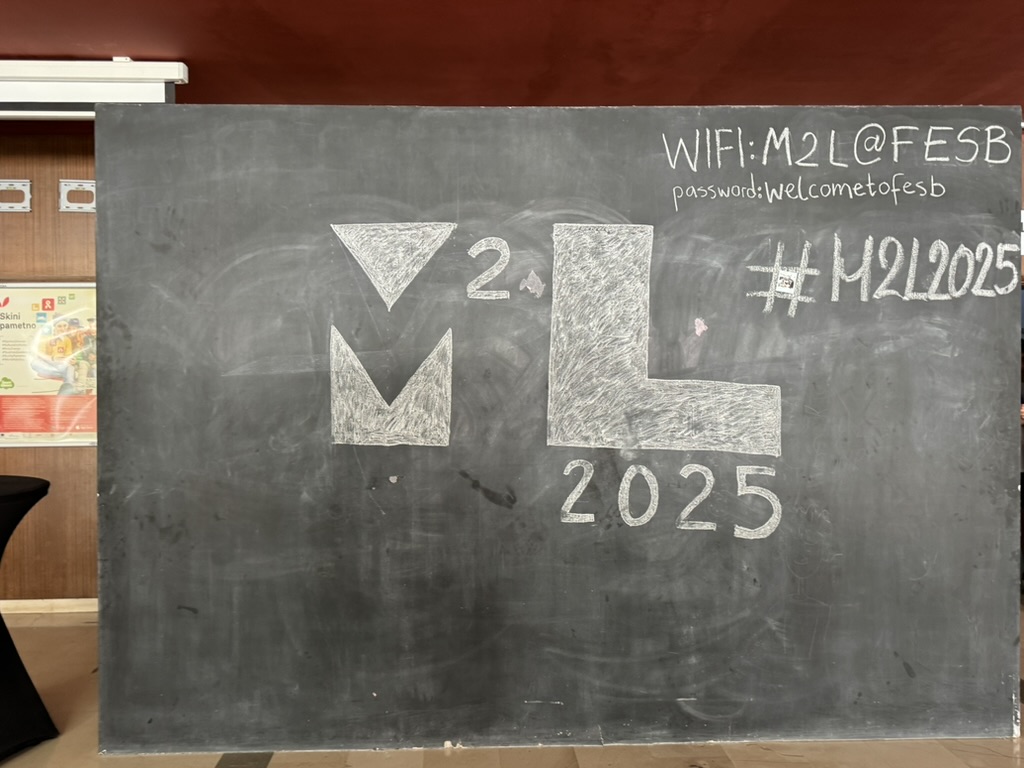 M2L 2025 logo on blackboard